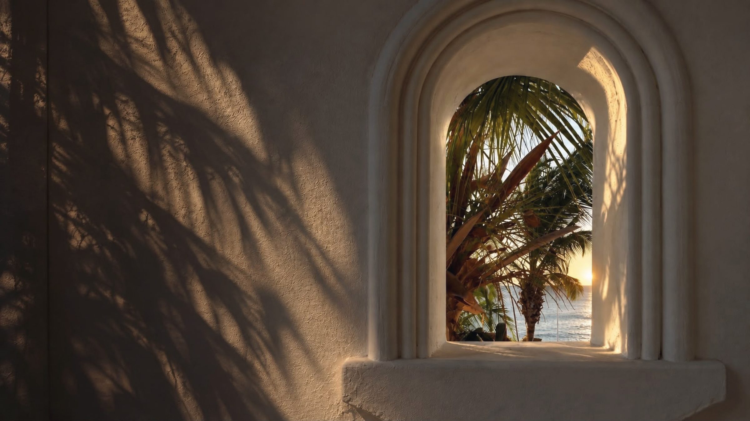 Sunset through an arched window over the sea in Phuket