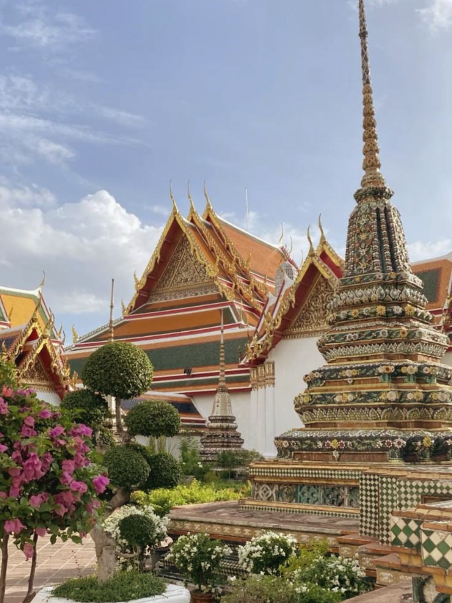 Gilded roofs and a tiled chedi at Wat Pho, Bangkok